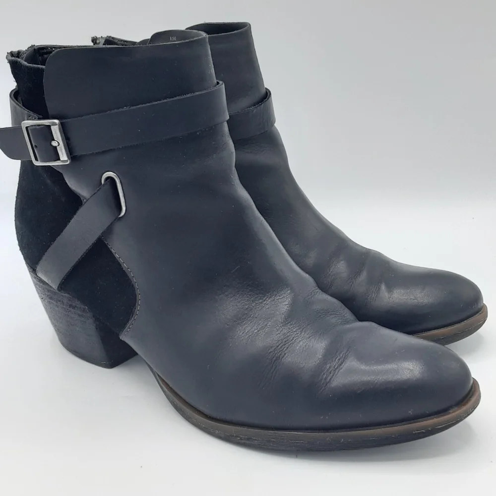 Korks Women's Rohit Black Leather Booties with Buckle Strap